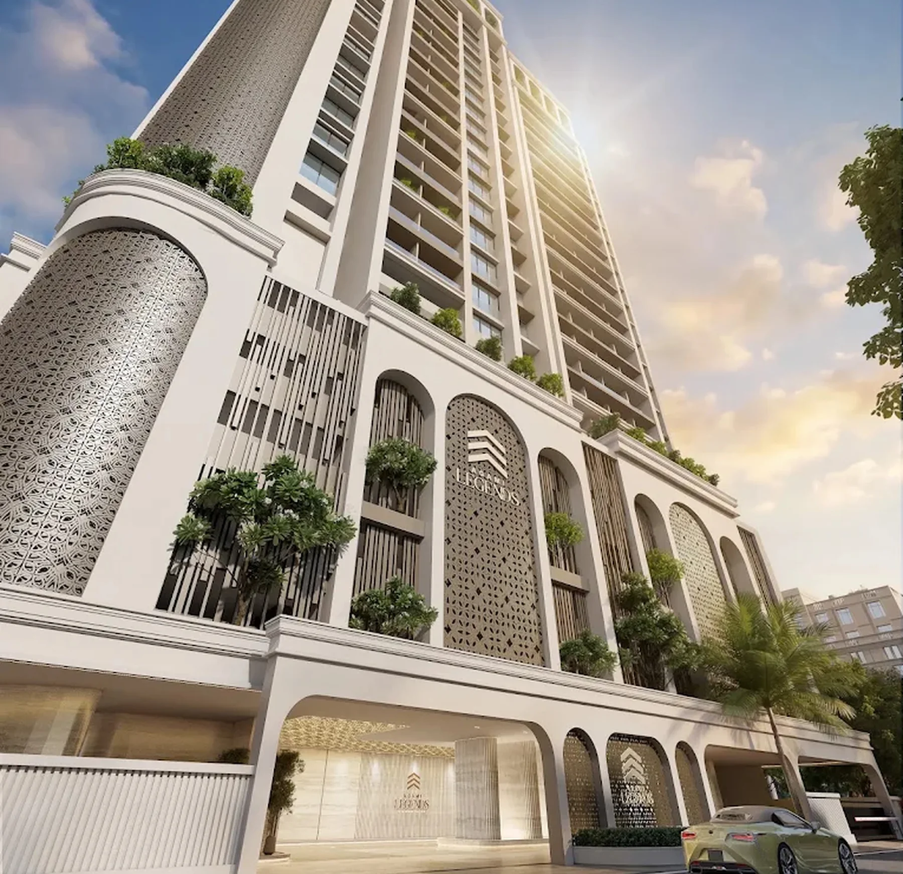Agami Legends tower facade with arched entrance and landscaped podium in Bandra